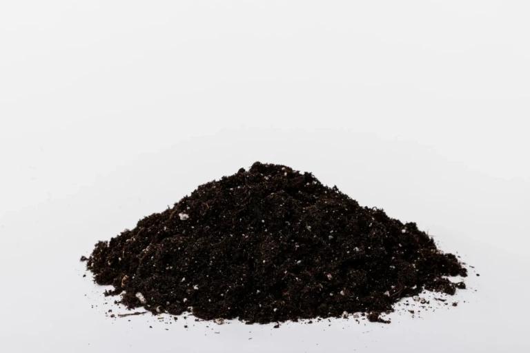 Pile of Black Gold All Purpose potting mix on white background showing dark, airy soil with perlite for container plants