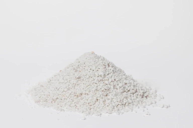 Close-up pile of white Black Gold perlite horticultural aggregate for soil aeration and drainage on a white background