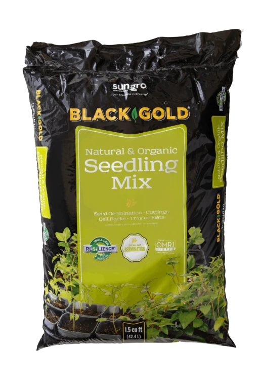 Black Gold Natural & Organic Seedling Mix 1.5 cu ft bag with young seedlings in cell packs for seed starting and cuttings