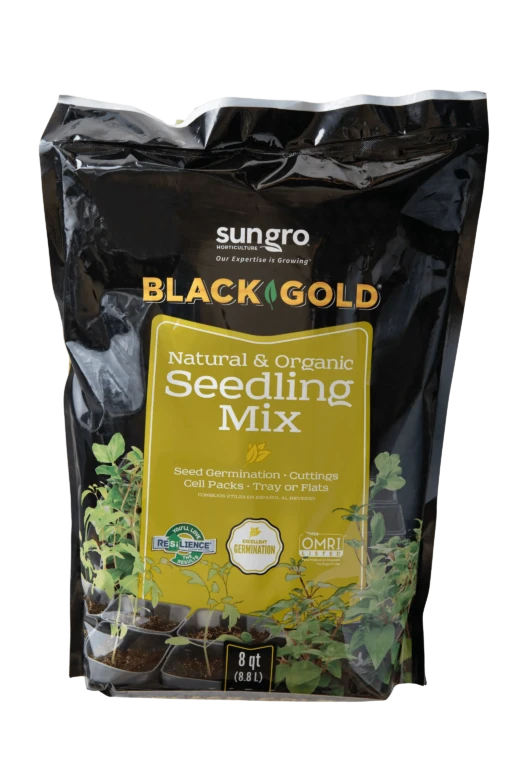 Black Gold Natural & Organic Seedling Mix 8 qt bag with seedlings in cell packs and branded Sun Gro packaging