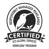Black Veriflora logo stamp with stylized flower icon and circular text for sustainable plant products, high-contrast on white